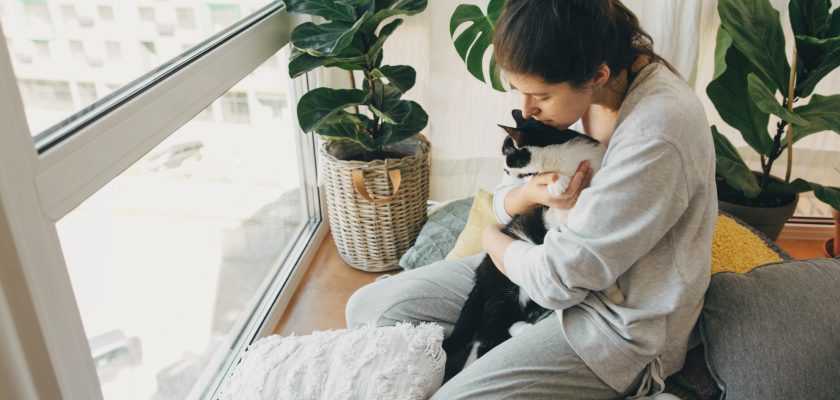 hipster girl hugging cute cat